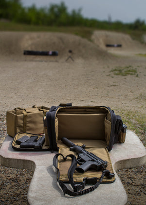 Range bag with MP5 shown on gun mat. Downrange shown in background.