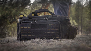 Loadout range bag in the field. Shown in black color with tan interior.