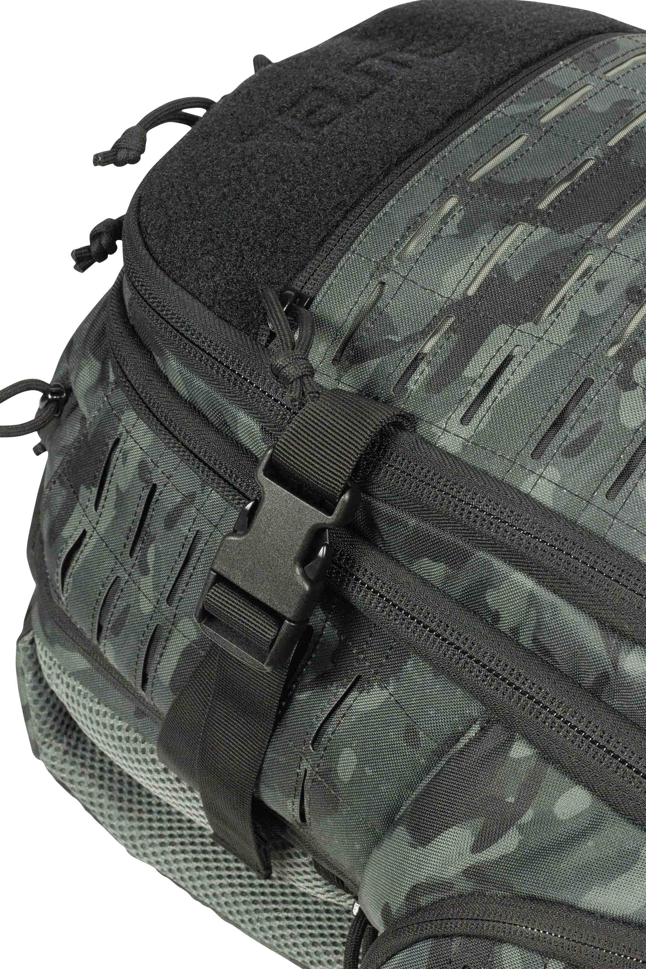 Closeup of CCW backpack, showing laser MOLLE and black camouflage.