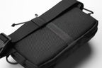 Black tactical pouch with mesh side on a white background