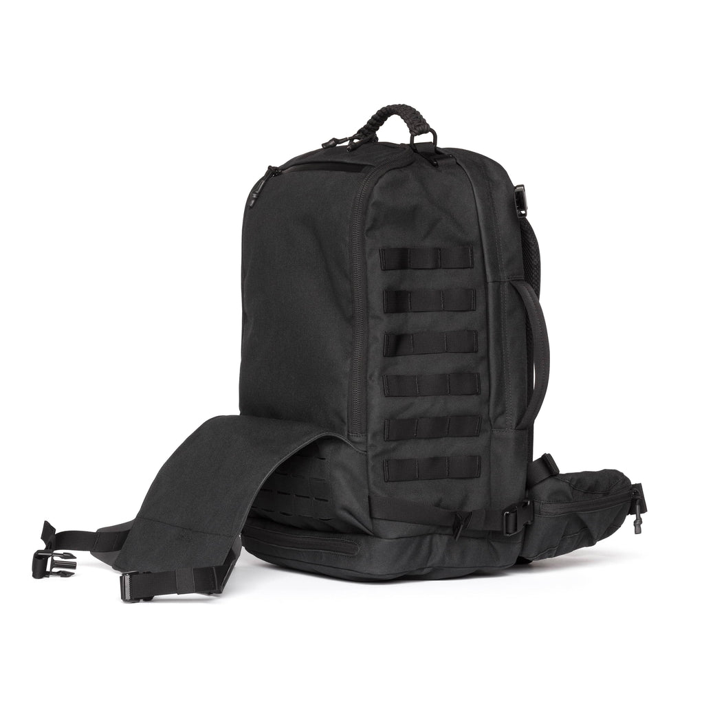 A black tactical backpack with MOLLE webbing on the front, a top carry handle, and an adjustable shoulder strap extended to the left, shown against a plain white background.