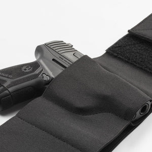 Black gun holster with a handgun on a white background