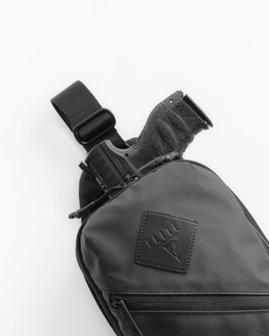 Black sling bag with a visible brand logo on a white background