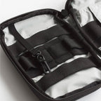 Close-up of a black strap and buckle on a white background