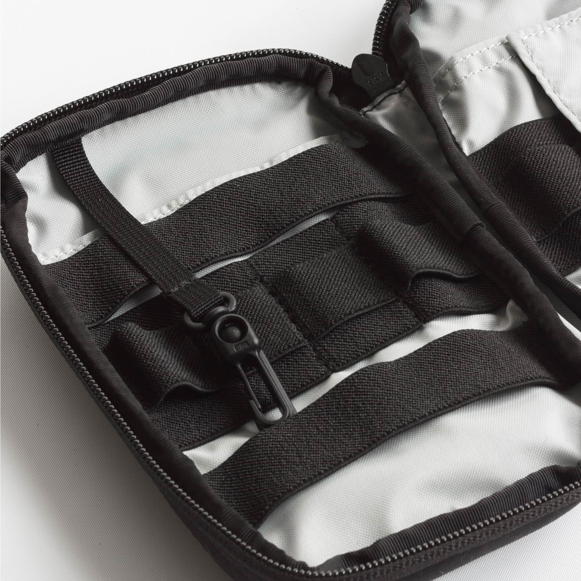 Close-up of a black strap and buckle on a white background