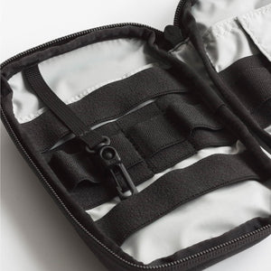 Close-up of a black strap and buckle on a white background