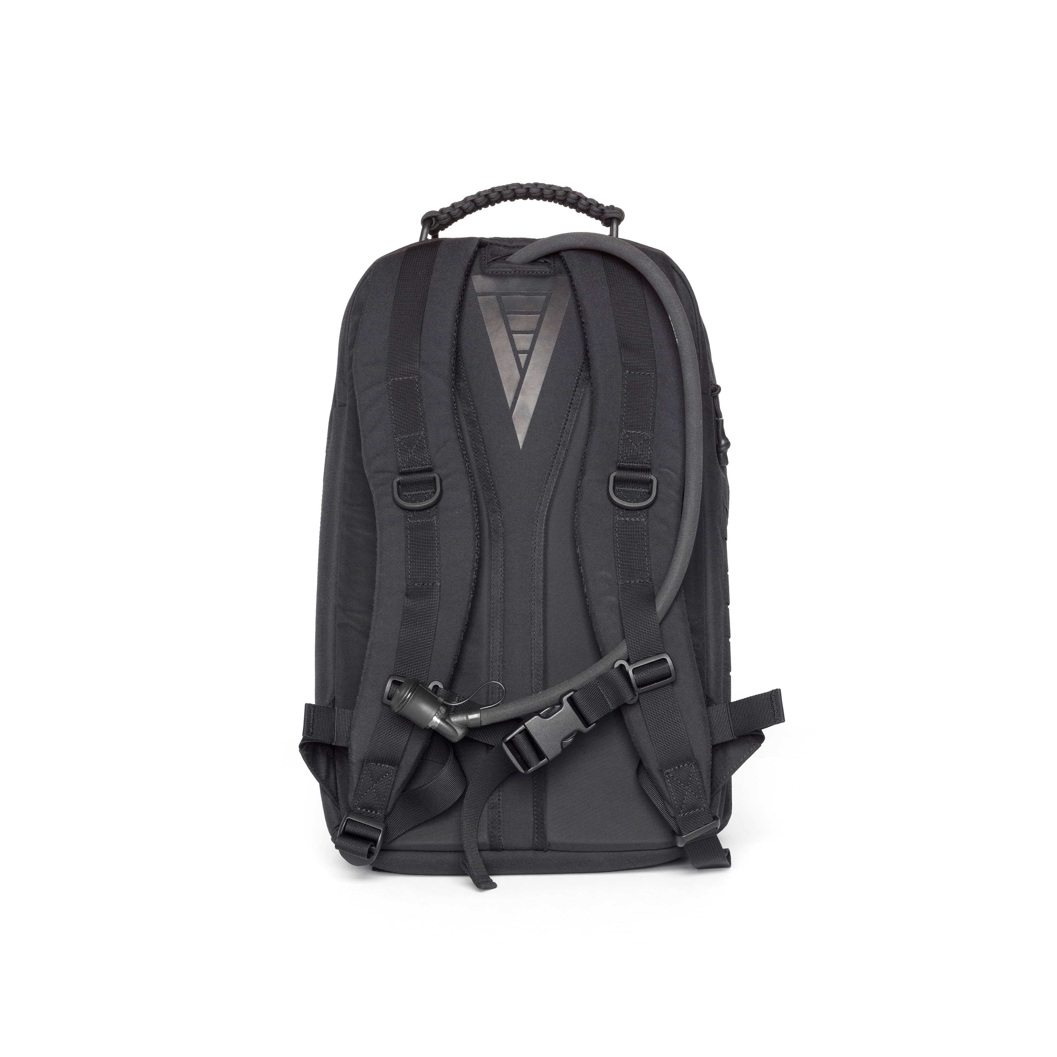 A black tactical backpack shown from the back, featuring padded shoulder straps, a top carry handle, and a quick-release buckle closure, photographed against a solid white background.