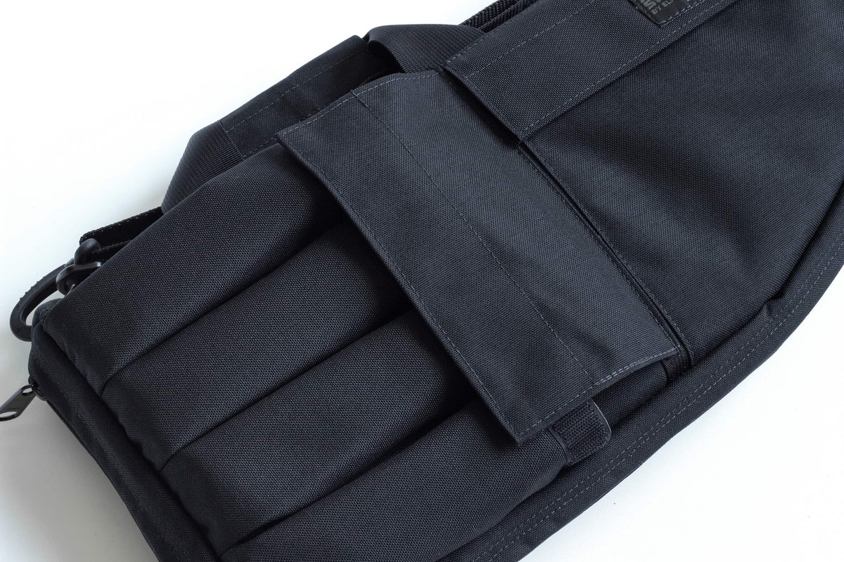 Black tactical magazine pouch on a white background
