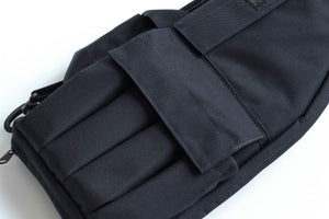 Black tactical magazine pouch on a white background