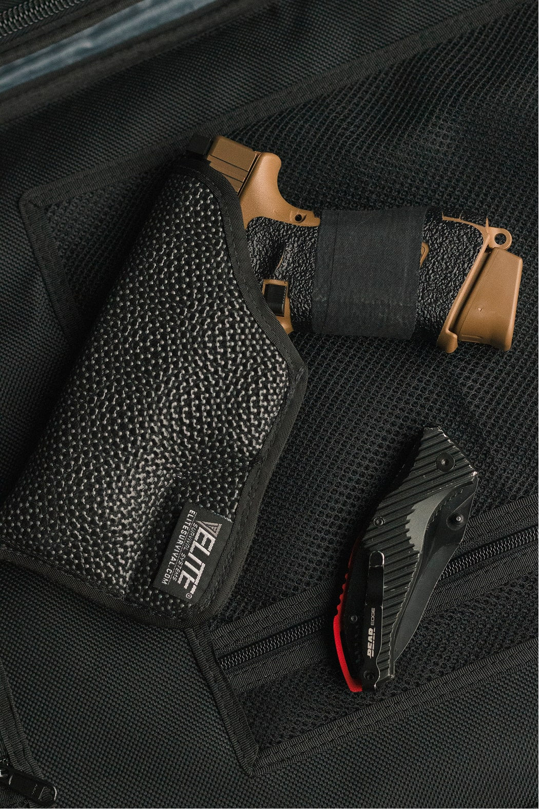 Black gun holster with a gun inside on a black background