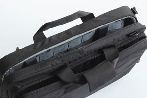 Black tactical bag with multiple compartments on a white background