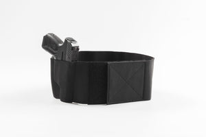 Black leather belt with a gun holster on a white background