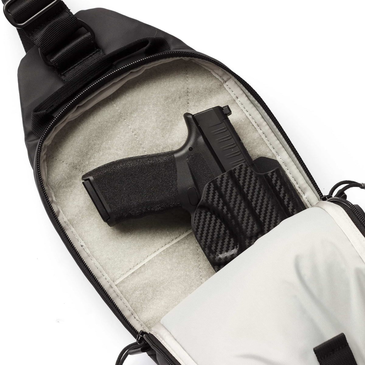 Sentinel sling pack carrying a Springfield Hellcat Pro