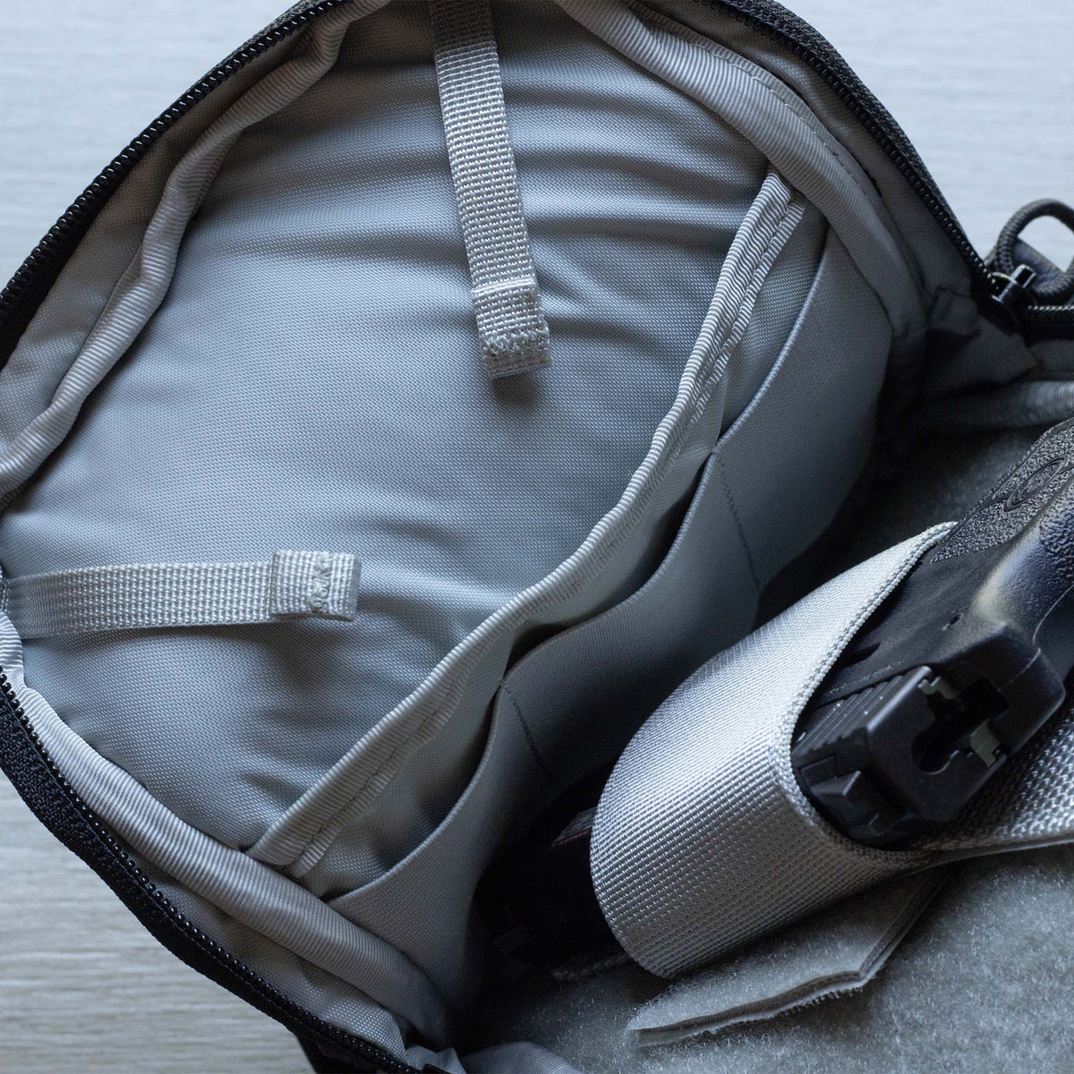 Close up of Elastic Magazine loops and Concelealed Carry Compartment