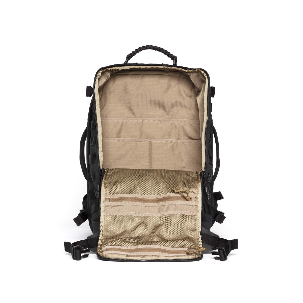 An open black backpack shown from the front, revealing a beige and tan interior with multiple zip compartments, mesh pockets, and a top carry handle, set against a plain white background.