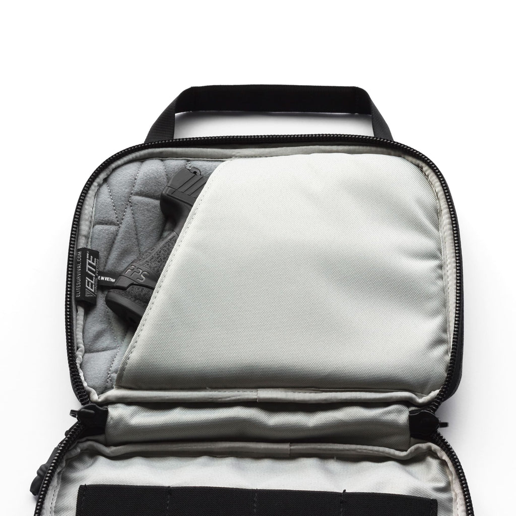 An open gray and black zippered protective case or organizer, shown from above on a white background. The interior is lined with gray fabric and has a black handle.