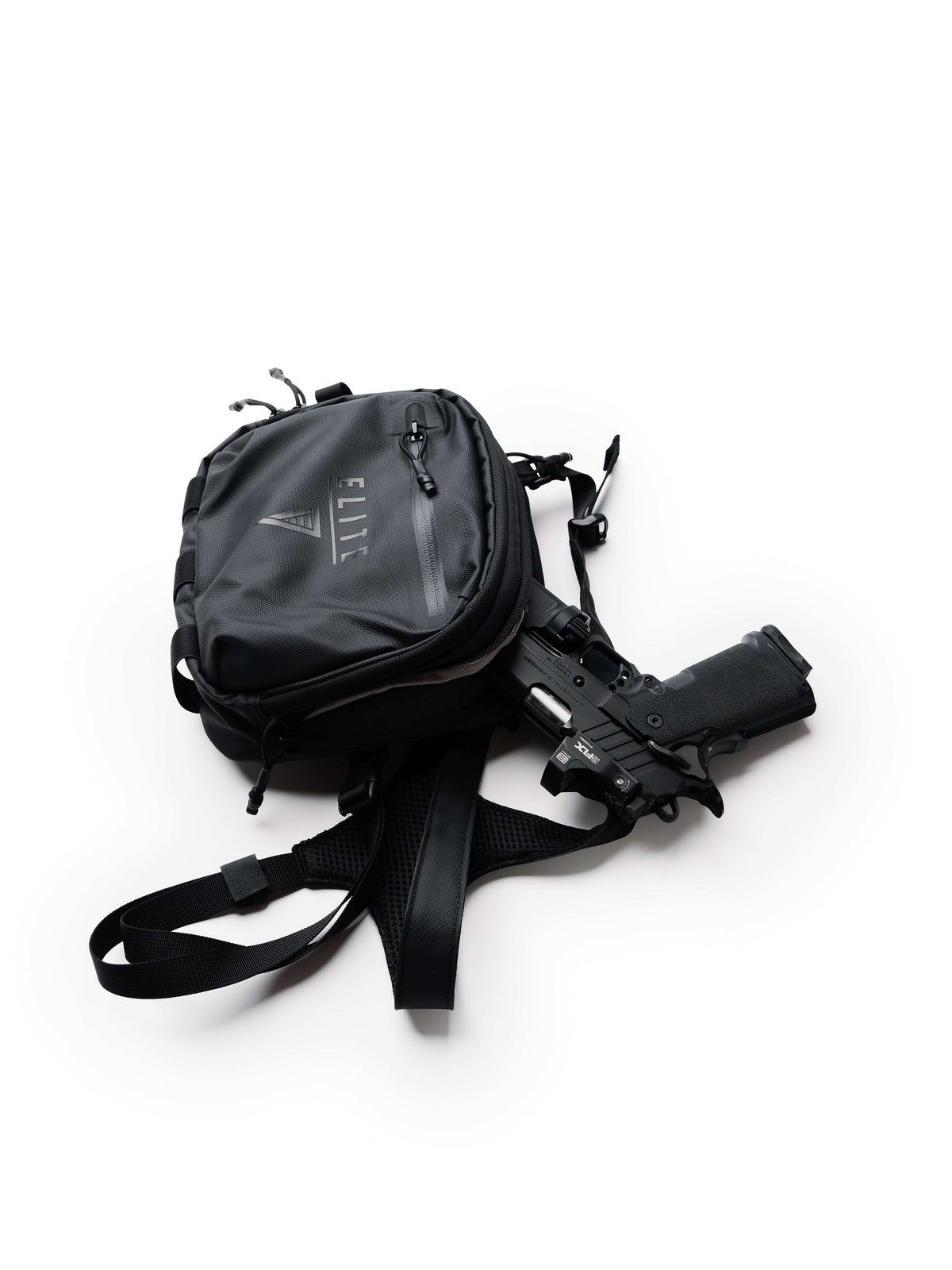 Handgun sitting in the rear concealed compartment of the black TrailGuard Concealed Carry Chest Holster