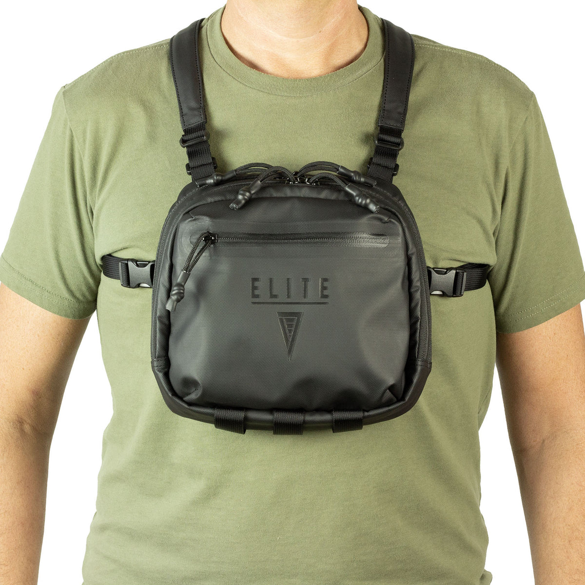 Person wearing a black CCW chest bag with 'ELITE' branding on a white background