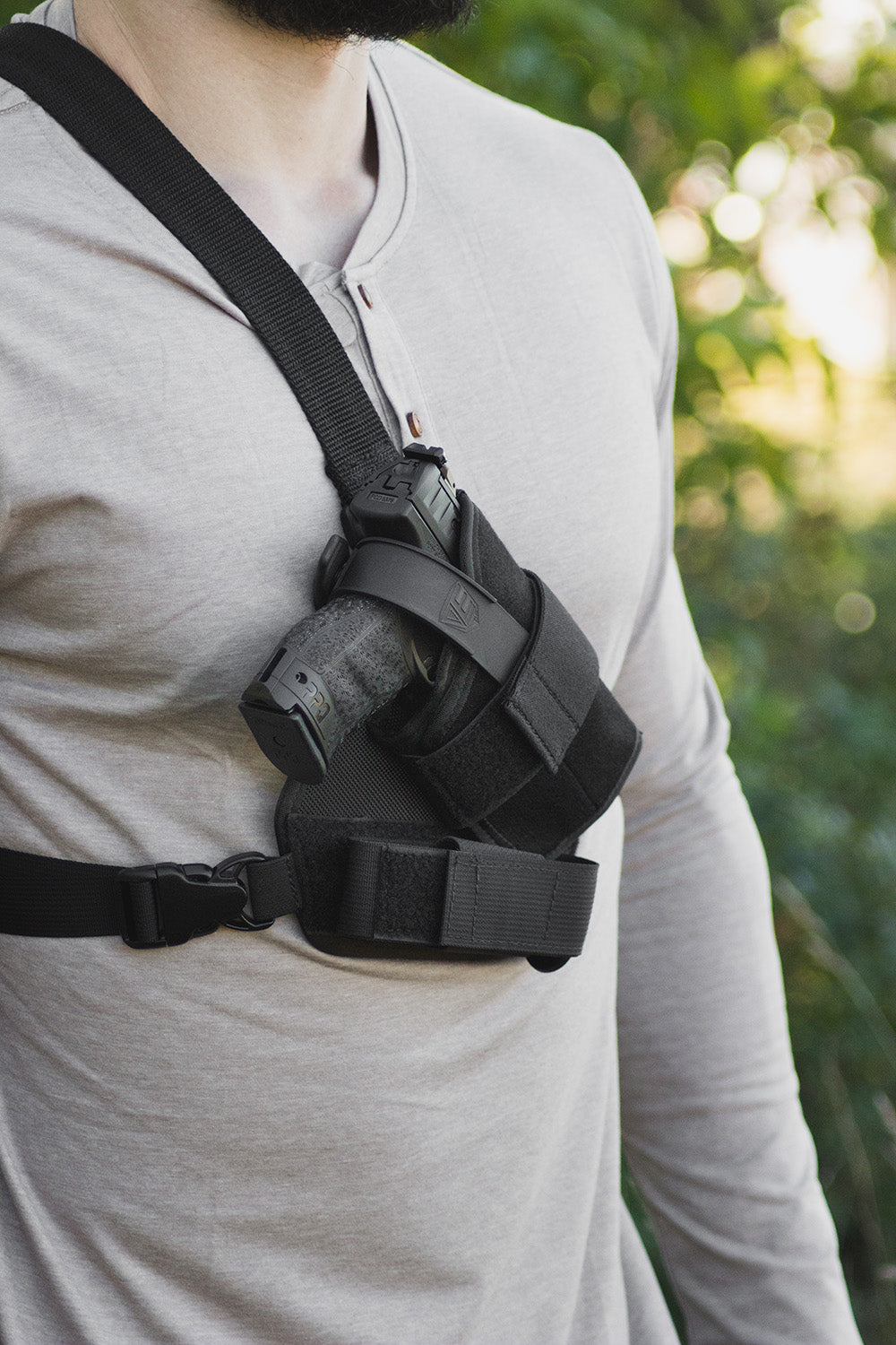 Warden chest holster is adjustable to fit guns with lights/lasers, or red dot sights.