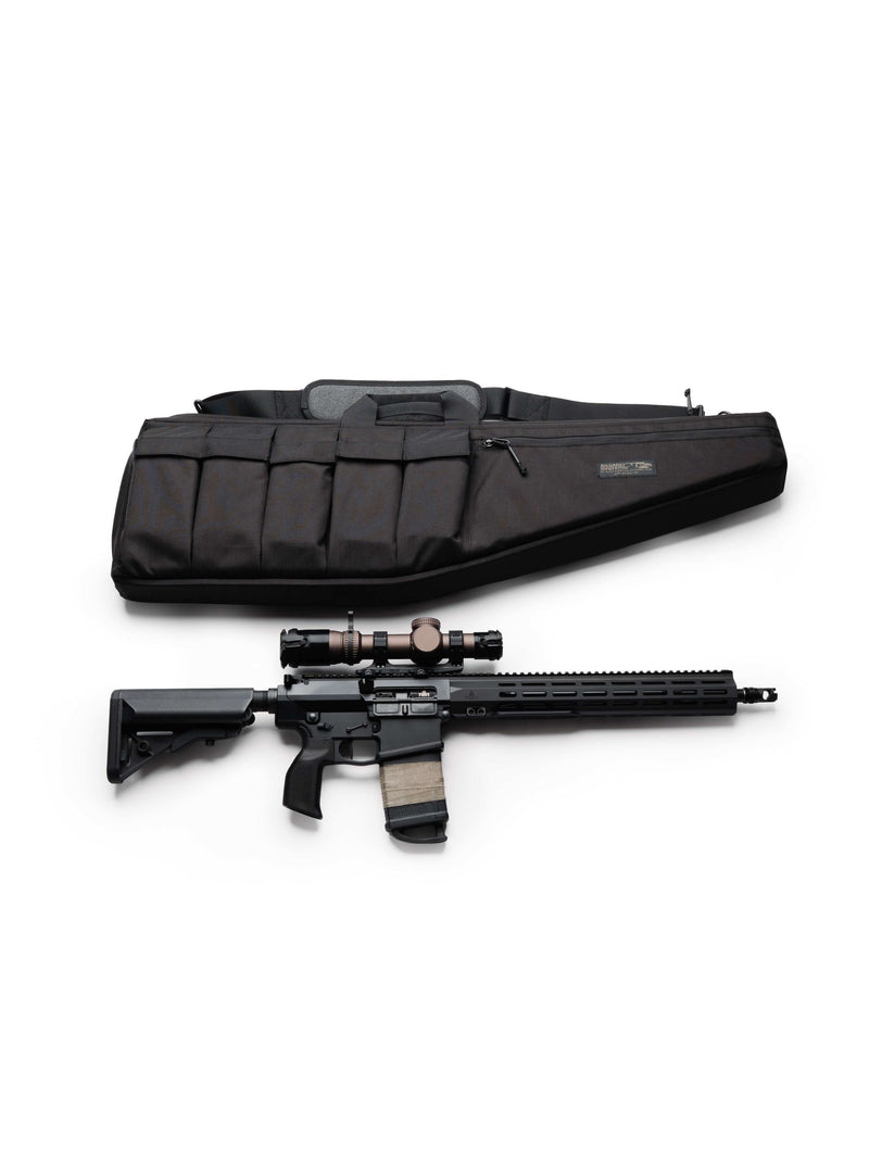 Black Assault Systems Tactical Rifle Case laid above a scoped AR-15 rifle to show the size fit