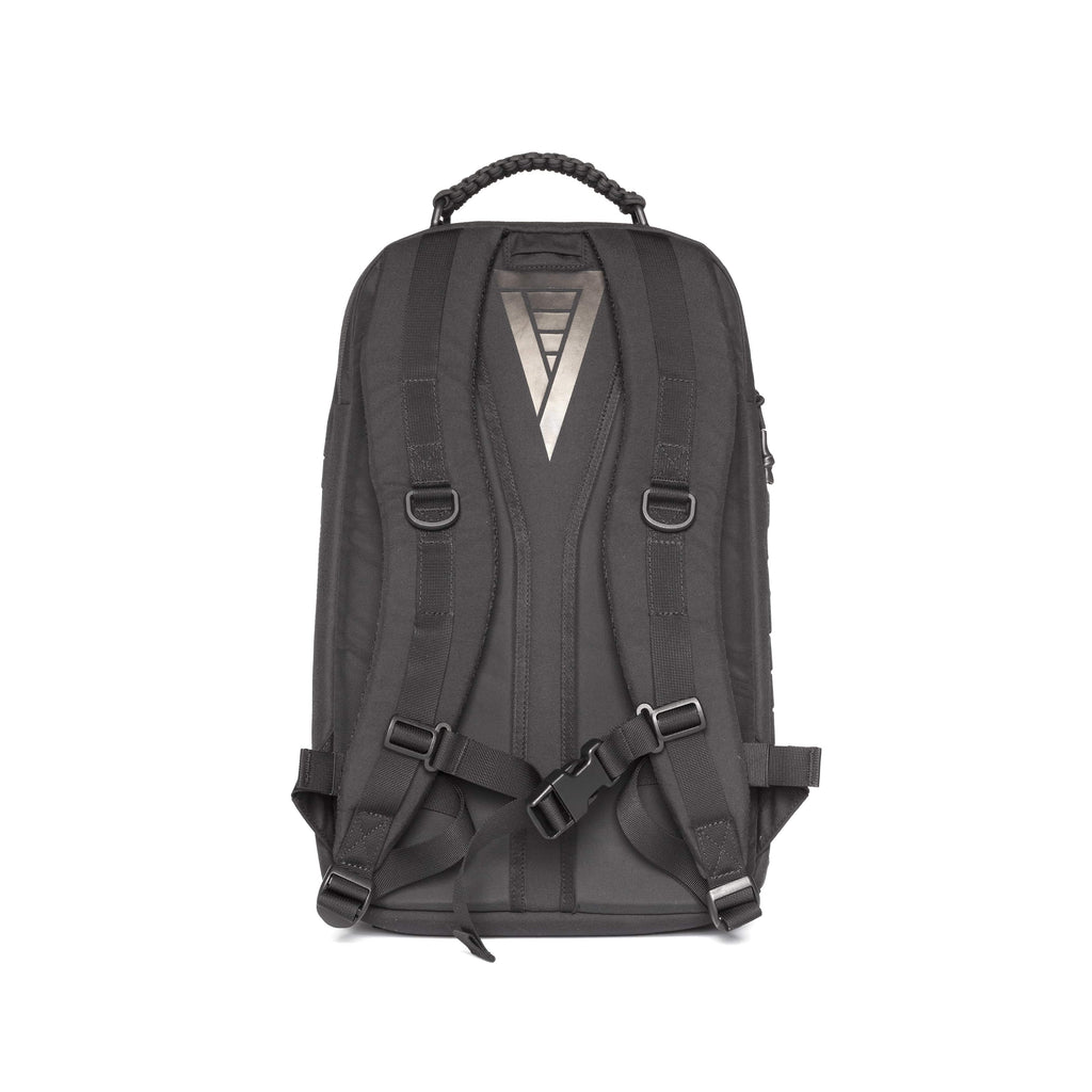 A dark gray backpack shown from the back, featuring a textured fabric body, padded shoulder straps with plastic buckles, a top carry handle, and a silver geometric logo on the upper back.