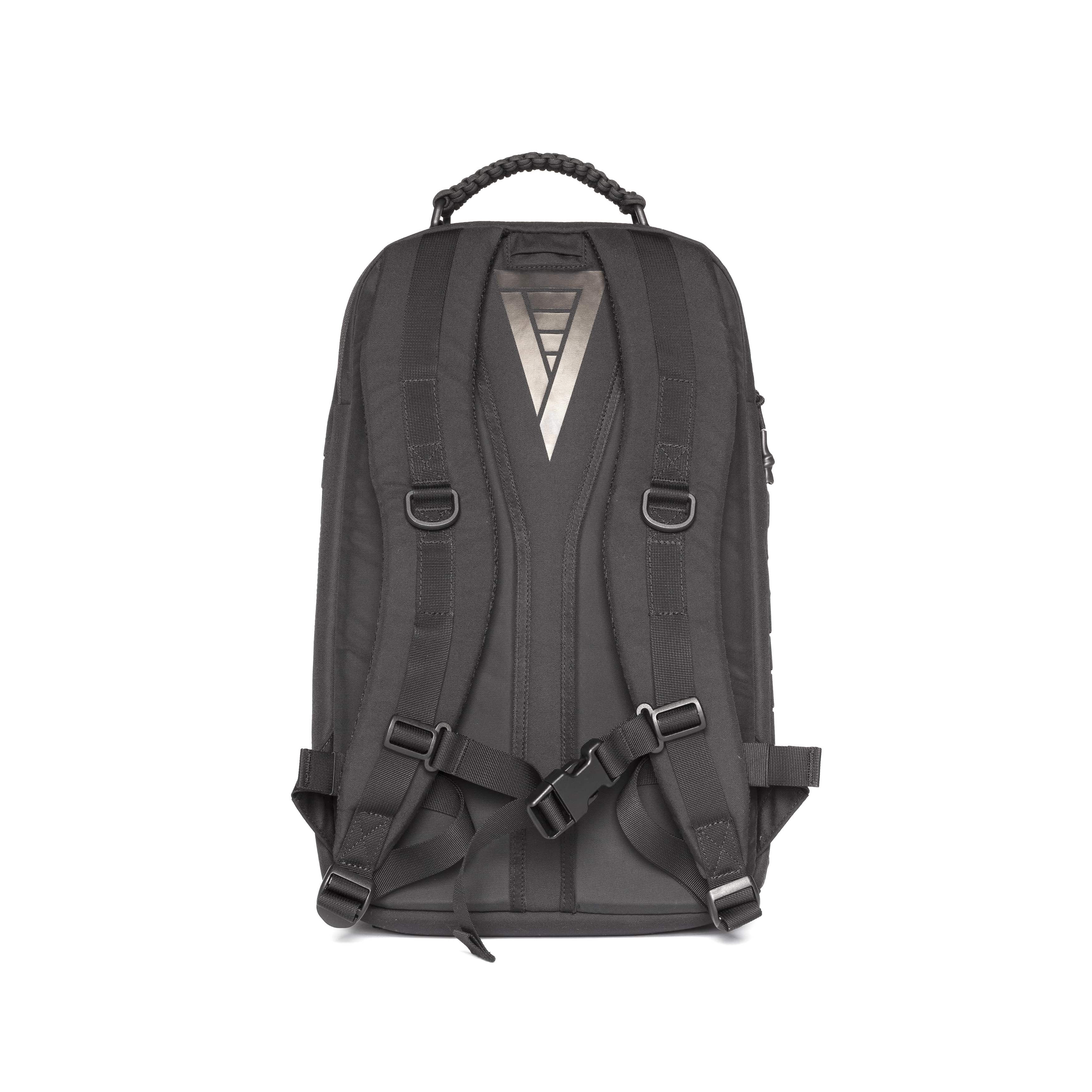 A dark gray backpack shown from the back, featuring a textured fabric body, padded shoulder straps with plastic buckles, a top carry handle, and a silver geometric logo on the upper back.