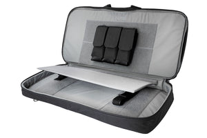 Interior of bullpub discreet rifle case. Includes removable magazine pouch, as well as tie-downs to secure the firearm.